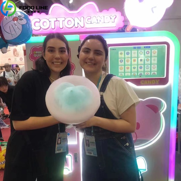 customers using cotton candy vending equipment