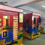 orange and blue orange juice vending machines
