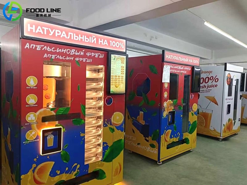 orange and blue orange juice vending machines